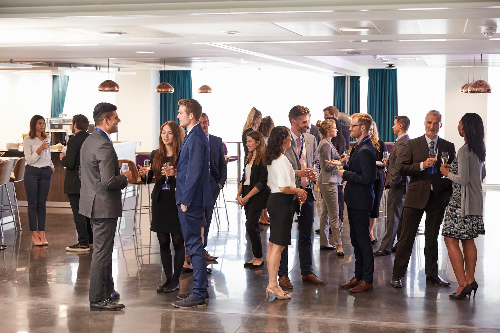 many people conversing at a networking event