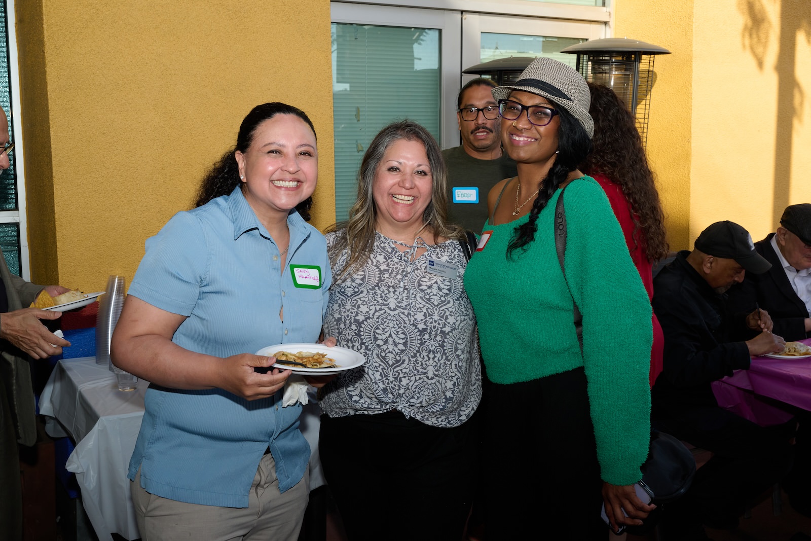 3 women smiling at the May Mixer